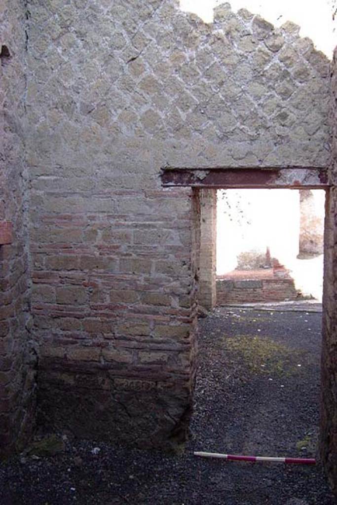 Ins Or II, 11, Herculaneum. July 2001. Doorway in west wall of middle rear room to shop-room.
Photo courtesy of Nicolas Monteix.